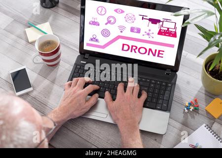 Drone concept shown on a laptop used by a man Stock Photo