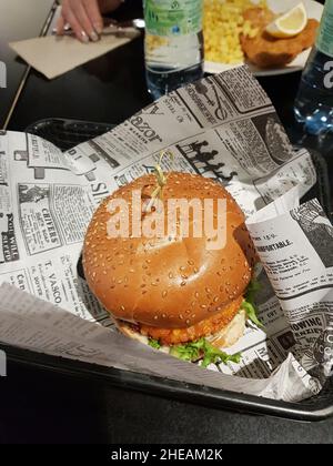 DUESSELDORF, NRW, GERMANY - NOVEMBER 11, 2019: Fresh tasty burger in an airport restaurant Stock Photo