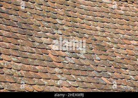 Shallow depth of field (selective focus) details of Transylvanian saxon traditional clay tiles. Stock Photo