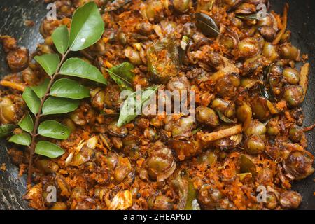 Clam meat fry kerala style kakka irachi fry Stock Photo