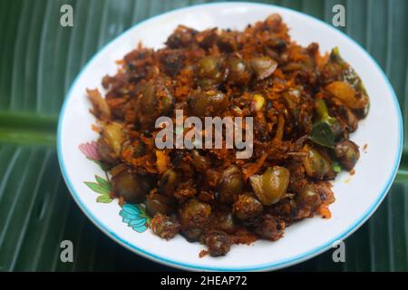 Clam meat fry kerala style kakka irachi fry Stock Photo