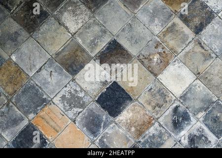 A background wall made of square bricks and tiles Stock Photo