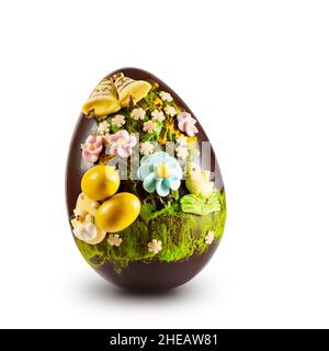 Chocolate easter egg with decorations on white background Stock Photo