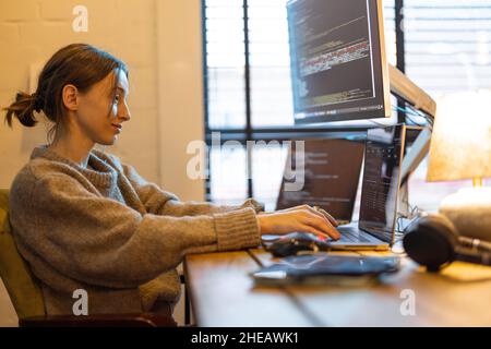Female programmer works from home Stock Photo