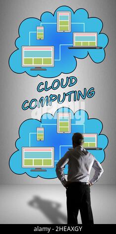 Businessman watching a cloud computing concept drawn on a wall Stock Photo
