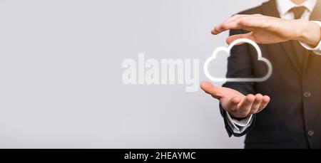 Hand holding icon cloud computing network and icon connection data information in hand. Cloud computing and technology concept Stock Photo
