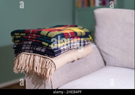 Stack of woolen checked blankets Stock Photo