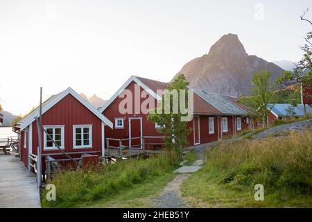 Scenic panorama view of norwegian beautiful nature and small fishing villages with typical rorbu wooden red cabins in Lofoten, northern Norway Stock Photo