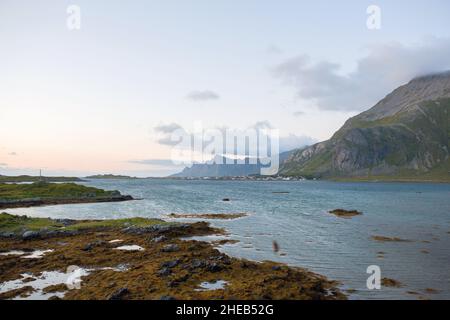 Scenic panorama view of norwegian beautiful nature and small fishing villages with typical rorbu wooden red cabins in Lofoten, northern Norway Stock Photo