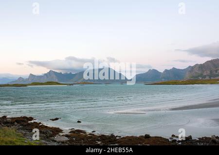 Scenic panorama view of norwegian beautiful nature and small fishing villages with typical rorbu wooden red cabins in Lofoten, northern Norway Stock Photo