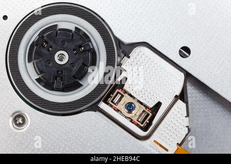 The internal structure of an optical disc drive. Motor spindle and laser head. Macro photography Stock Photo