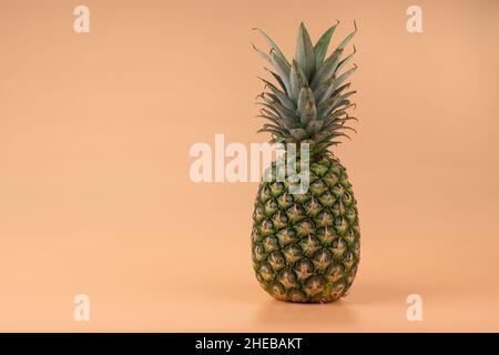 Creative copy space mockup with tropical fruit pineapple. For writing text in the concept of food on a yellow background. Stock Photo