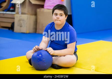 Belarus, the city of Gomel, June 23, 2021. Judo club. A child with Down syndrome in the gym. Stock Photo