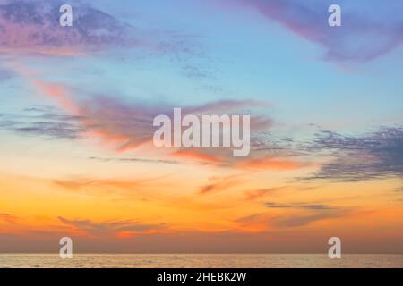 Evening sky with dramatic clouds over the sea. Dramatic sunset over the sea Stock Photo