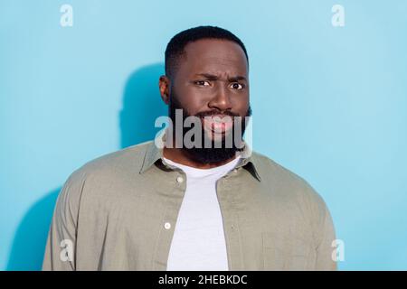 Photo of young african man discontent dissatisfied problem fail face reaction isolated over blue color background Stock Photo