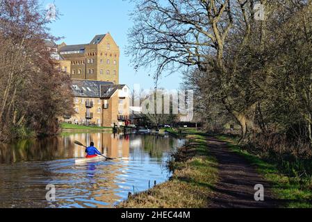 Coxes Lock Mill apartments on the River Wey Navigation canal on a sunny winters day Addlestone Surrey England UK Stock Photo