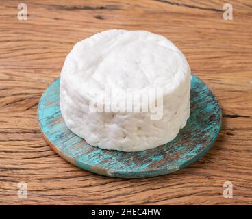 Frescal cheese, typical brazilian fresh white cheese over wooden table. Stock Photo