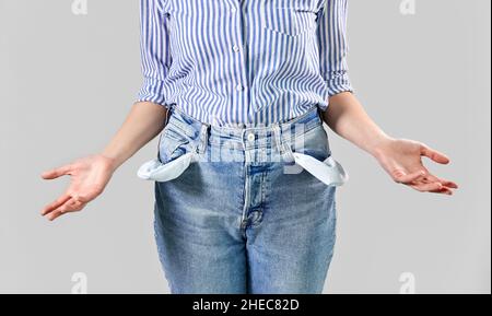 close up of woman showing empty pockets Stock Photo