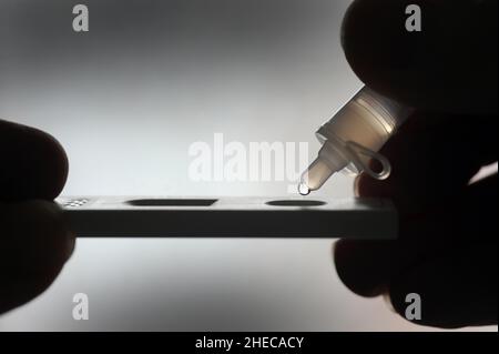 COVID 19 LATERAL FLOW TEST RE TESTING PANDEMIC CORONAVIRUS OMICRON INFECTIONS ETC UK Stock Photo