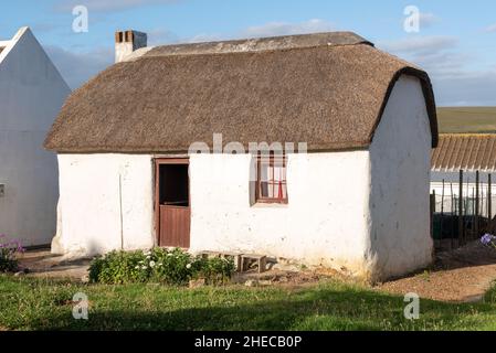 Thatched cottage at Elim village in the Western Cape of South Africa, established by German missionaries as a Moravian mission, 30 December 2021. Stock Photo