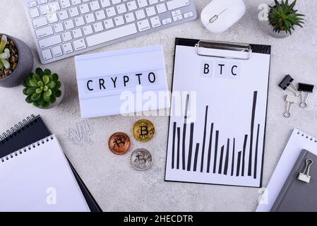 Bitcoin shedule on desk. Cryptocurrency concept Stock Photo
