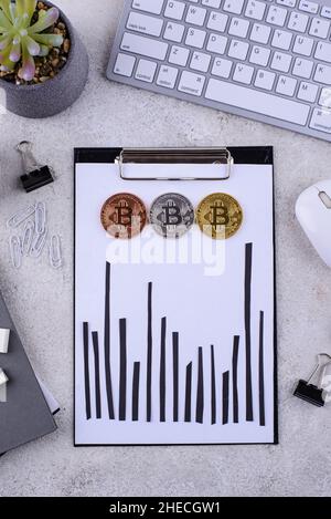 Bitcoin shedule on desk. Cryptocurrency concept Stock Photo