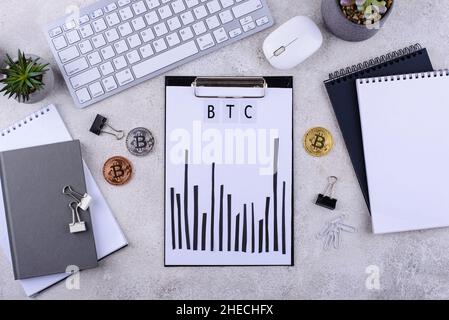 Bitcoin shedule on desk. Cryptocurrency concept Stock Photo
