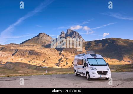 France, Pyrenees Atlantiques, Bearn, Motorhome parked at Col du Pourtalet with the Pic du Midi d'Ossau in the background Stock Photo