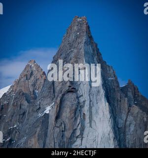 France, Nature sometimes adopts very curious forms called Pareidolie, a wise man's face draws in the needle of the Drus guardian of the Mont Blanc massif Stock Photo