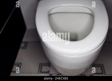 White toilet bowl in bathroom Stock Photo
