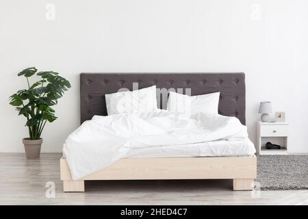 Interior Shot With Big Comfortable Double Bed In Stylish Modern Room Stock Photo
