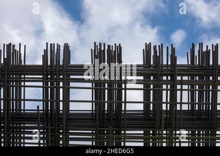 Reinforcing bars framework for armored concrete construction. Blue cloudy sky Stock Photo