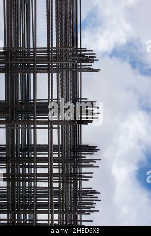 Reinforcing bars framework for armored concrete construction. Blue cloudy sky Stock Photo