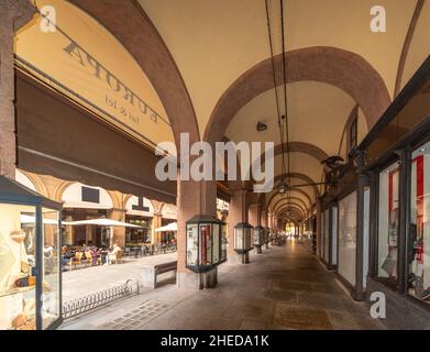 Saluzzo, Cuneo, Italy - October 19, 2021: The arcades of via Silvio Pellico, central pedestrian street Stock Photo