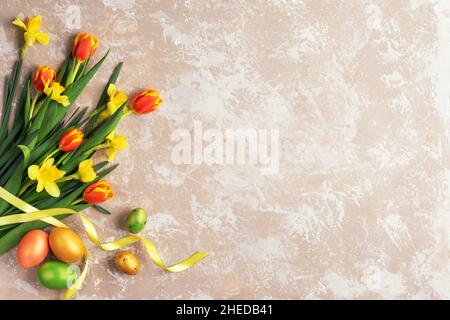 Happy Easter card. Congratulatory easter background. Easter eggs and flowers. Stock Photo