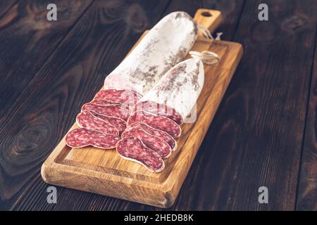 Sliced fuet Catalan cured sausage on the cutting board Stock Photo