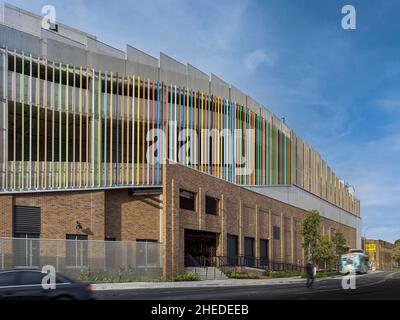 Feature brick and coloured timber batten facade. Marrickville Metro, Sydney, Australia. Architect: Hames Sharley, 2021. Stock Photo