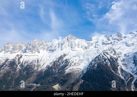 This landscape photo was taken in Europe, in France, in the Alps, towards Chamonix, in the spring. We can see the Mont Blanc massif, under the Sun. Stock Photo