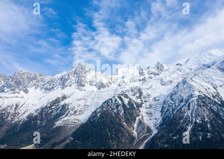 This landscape photo was taken in Europe, in France, in the Alps, towards Chamonix, in the spring. We can see the Mont Blanc massif, under the Sun. Stock Photo