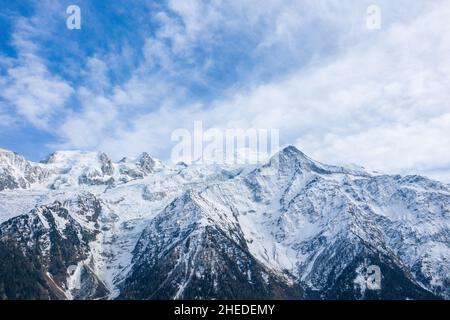 This landscape photo was taken in Europe, in France, in the Alps, towards Chamonix, in the spring. We see the close-up on the Mont Blanc massif, under Stock Photo