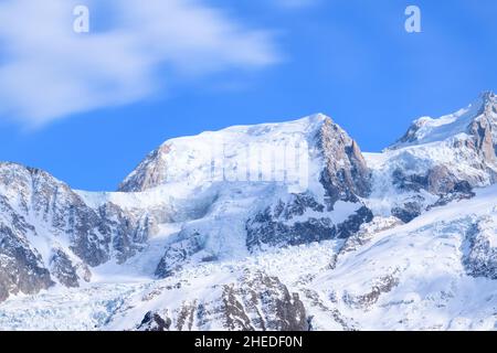 This landscape photo was taken in Europe, in France, in the Alps, towards Chamonix, in the spring. We can see Mont Blanc du Tacul, under the Sun. Stock Photo
