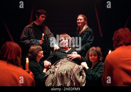 The Passion: Sue Johnston (Mary Mother - centre, in wheelchair) with (clockwise, from front left) Linda Thompson, Iain Roberston, Joanna Page (Mary Salome), Cathryn Bradshaw (Mary Magdalene) in THE MYSTERIES at the Cottesloe Theatre, National Theatre (NT), London SE1  18/12/1999  in a version by Tony Harrison  design: William Dudley  lighting: Laurie Clayton  director: Bill Bryden Stock Photo