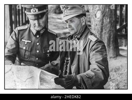 Operation Barbarossa WW2 Two Nazi German Army Generals on the Eastern Front are studying the map a propaganda image to show all is going well to Germans back home. Stock Photo