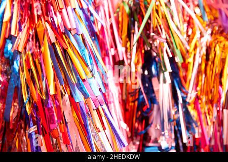 multicolored bright background of colored strips of colored shiny foil Stock Photo