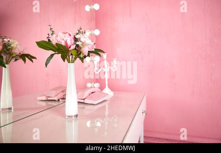 vase on a table in a pink interior. copy space. Stock Photo