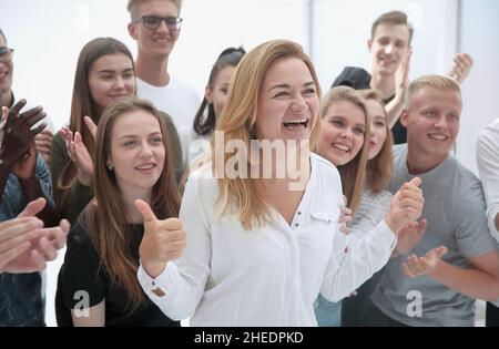 group of young people supporting their happy leader Stock Photo