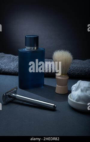 Helsinki / Finland - JANUARY 10, 2022: Closeup of men's toilet accessories: a razor, a shaving brush, and some shaving foam. Stock Photo