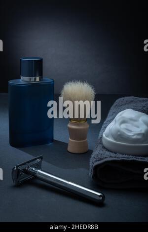 Helsinki / Finland - JANUARY 10, 2022: Closeup of men's toilet accessories: a razor, a shaving brush, and some shaving foam. Stock Photo