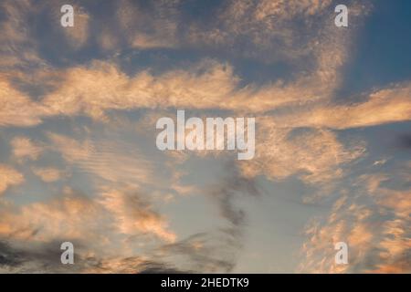Pink orange morning clouds on evening sky Stock Photo