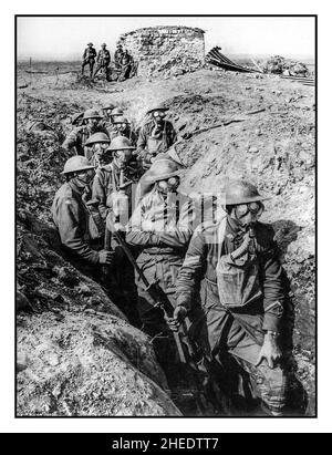 Australian infantry wearing gas masks with box respirators in a trench ...